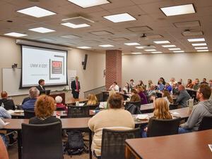 Chance Hergott and Zach Weiss present to a group of people. 